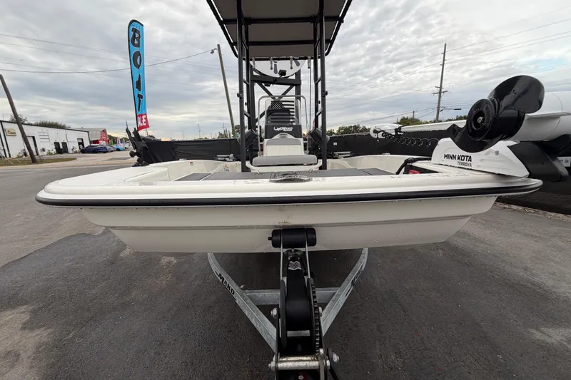 Slide: The Image of 2024 Mako Pro Skiff 15 CC boat on trailer, displayed outdoors for sale. - 9