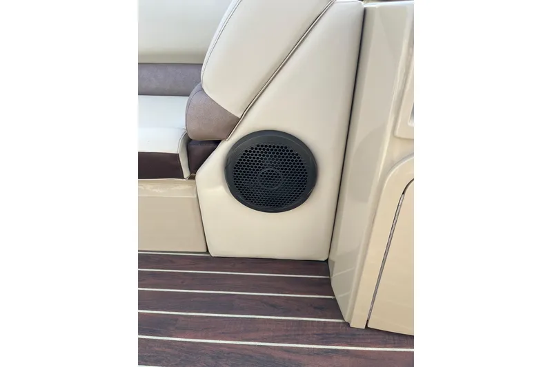 Slide: The Image of Speaker on 2018 Crest Classic 250 SLS boat with beige seating and wood flooring. - 16