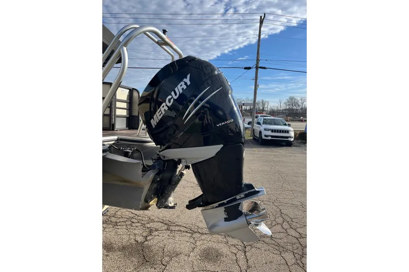 Slide: The Image of 2018 Crest Classic 250 SLS with Mercury Verado outboard motor in parking lot. - 19