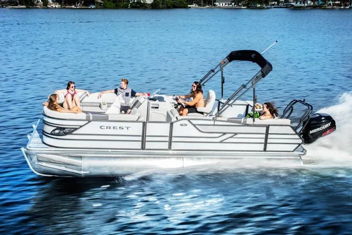 Slide: The Image of 2018 Crest Classic 250 SLS boat interior with beige captain's chair and control panel. - 3