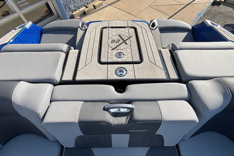 Slide: The Image of 2022 MasterCraft X26 boat interior with sleek seating and stylish design. - 14