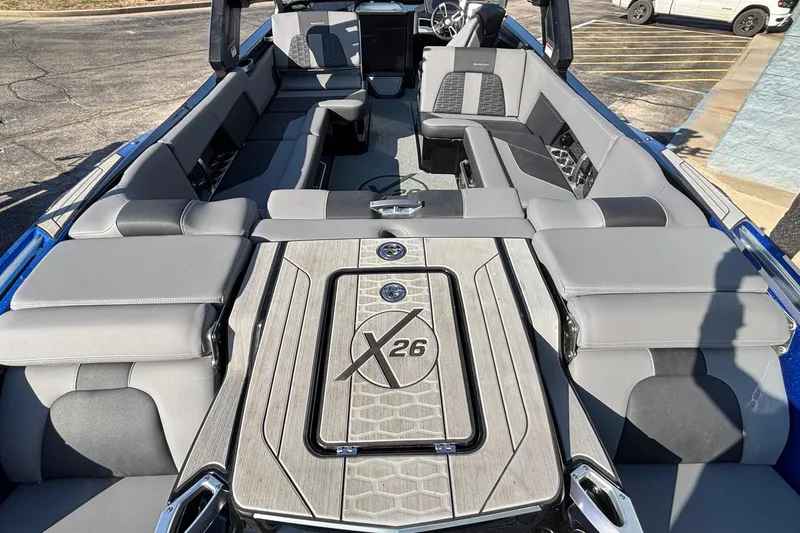 Slide: The Image of 2022 MasterCraft X26 boat interior with sleek seating and stylish design. - 15