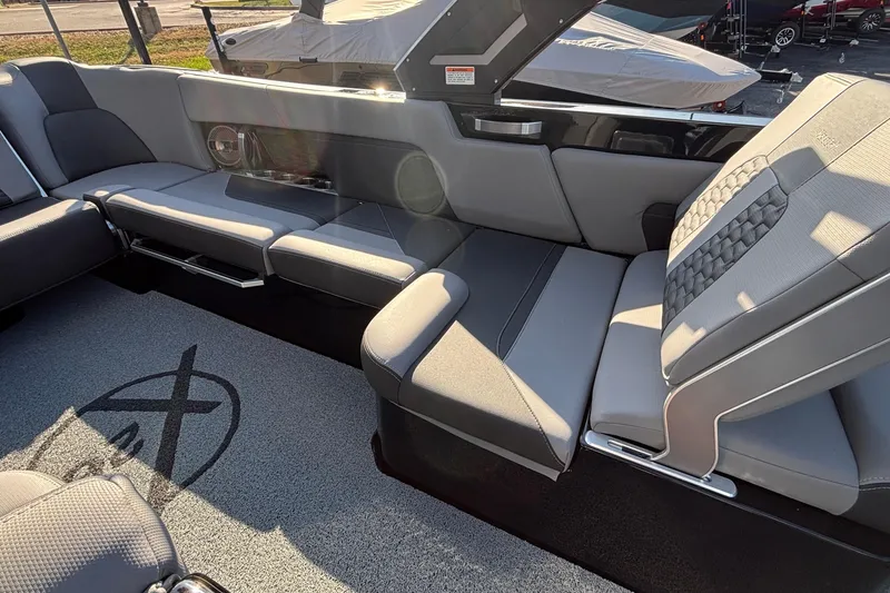 Slide: The Image of 2022 MasterCraft X26 interior with luxurious gray seating and stylish design. - 20