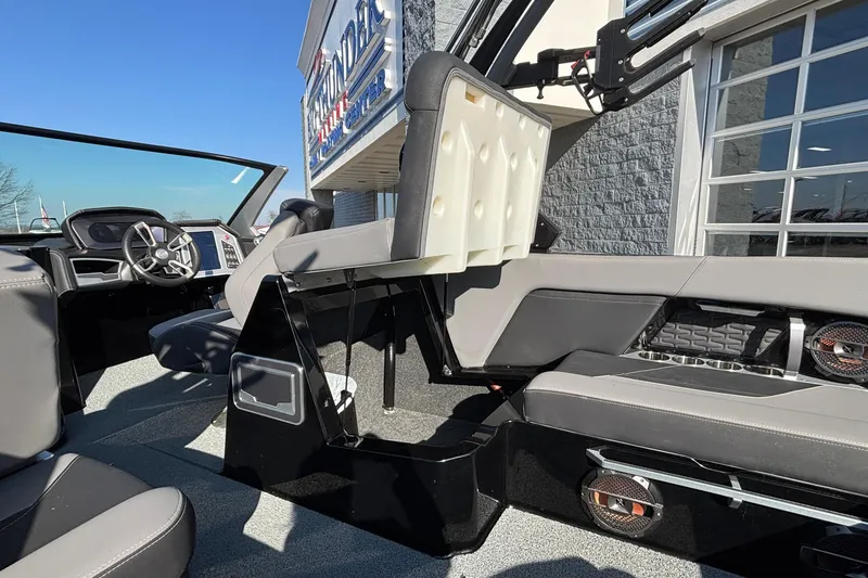 Slide: The Image of 2022 MasterCraft X26 boat interior with modern seating and dashboard design. - 33