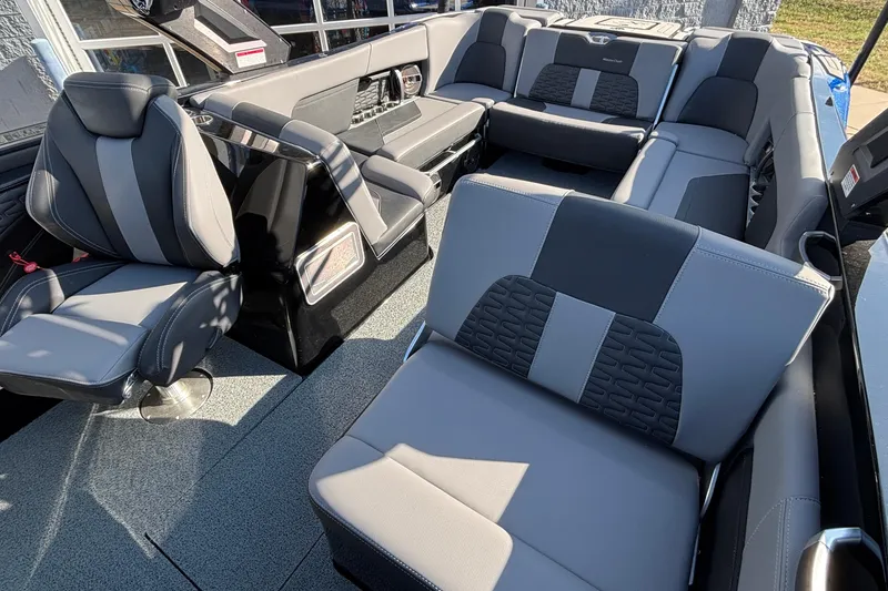 Slide: The Image of 2022 MasterCraft X26 boat interior with luxurious gray seating and modern design. - 36