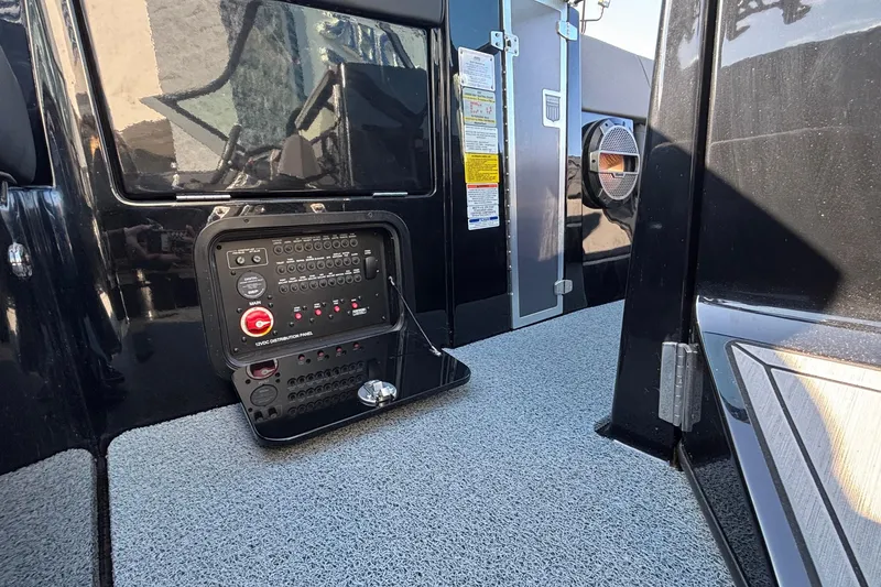 Slide: The Image of 2022 MasterCraft X26 boat interior with control panel and speaker. - 49