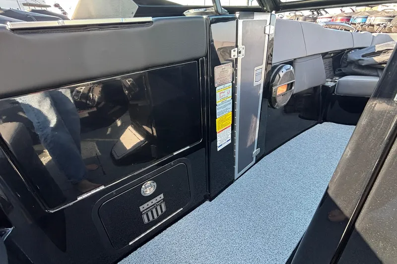 Slide: The Image of 2022 MasterCraft X26 interior with sleek black design and modern features. - 51