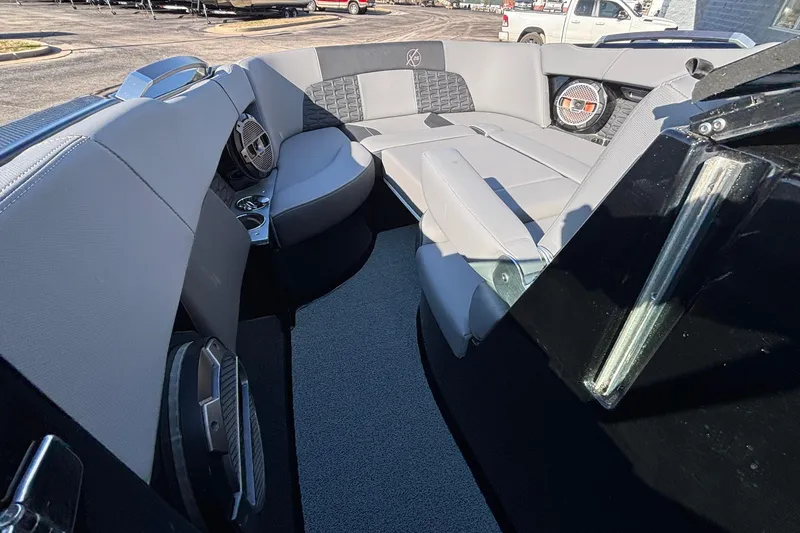 Slide: The Image of 2022 MasterCraft X26 boat interior with gray seating and modern design. - 57