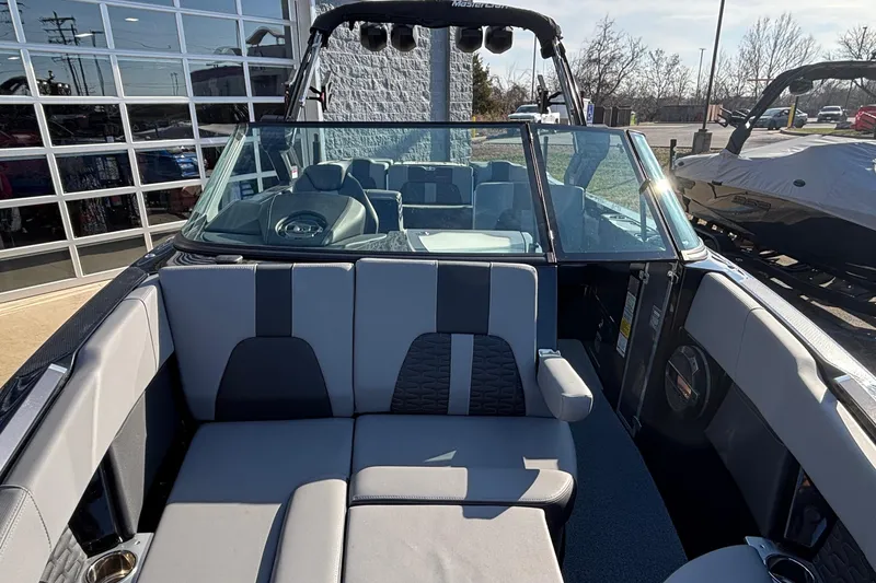 Slide: The Image of 2022 MasterCraft X26 boat interior with luxurious seating and modern design. - 60