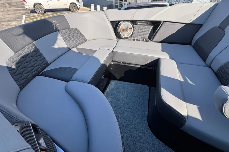 Slide: The Image of 2022 MasterCraft X26 boat interior with luxurious seating and modern design. - 63