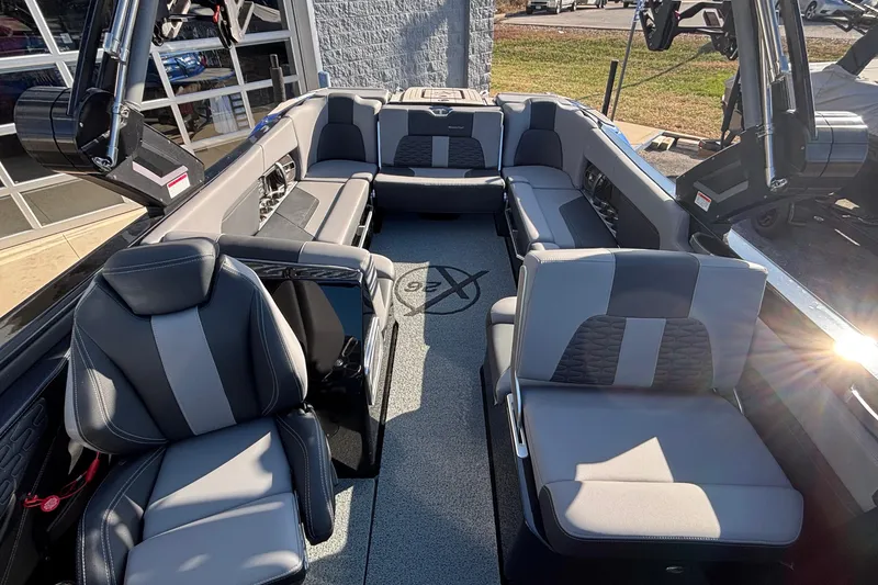 Slide: The Image of 2022 MasterCraft X26 boat interior with luxurious seating and modern design. - 66