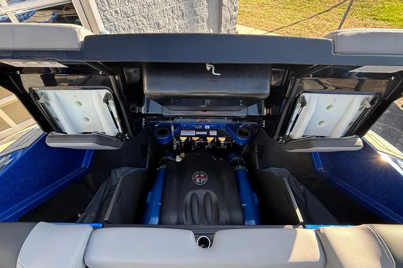 Slide: The Image of 2022 MasterCraft X26 engine compartment with open hatch, showcasing modern design and components. - 73