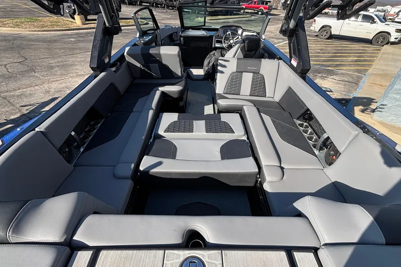 Slide: The Image of Interior of a 2022 MasterCraft X26 boat with luxurious seating and modern design. - 77