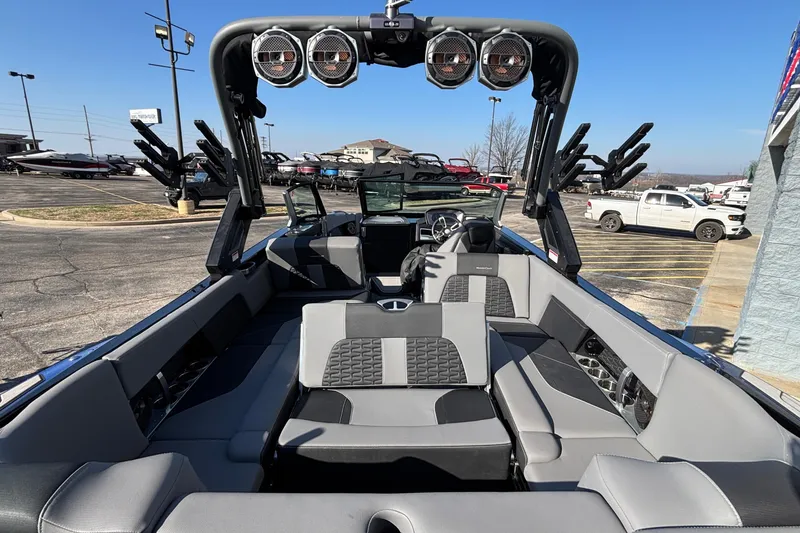 Slide: The Image of 2022 MasterCraft X26 boat interior with luxury seating and advanced audio system. - 78