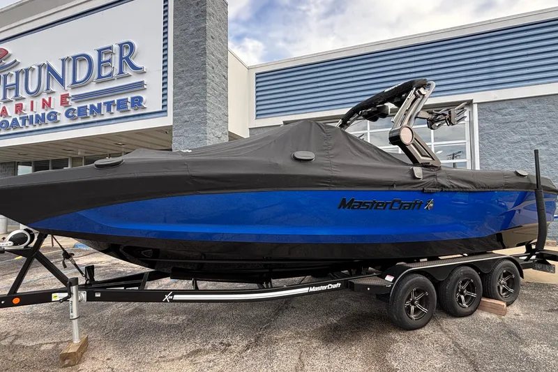 Slide: The Image of 2022 MasterCraft X26 boat with cover on trailer at Thunder Marine Boating Center. - 79