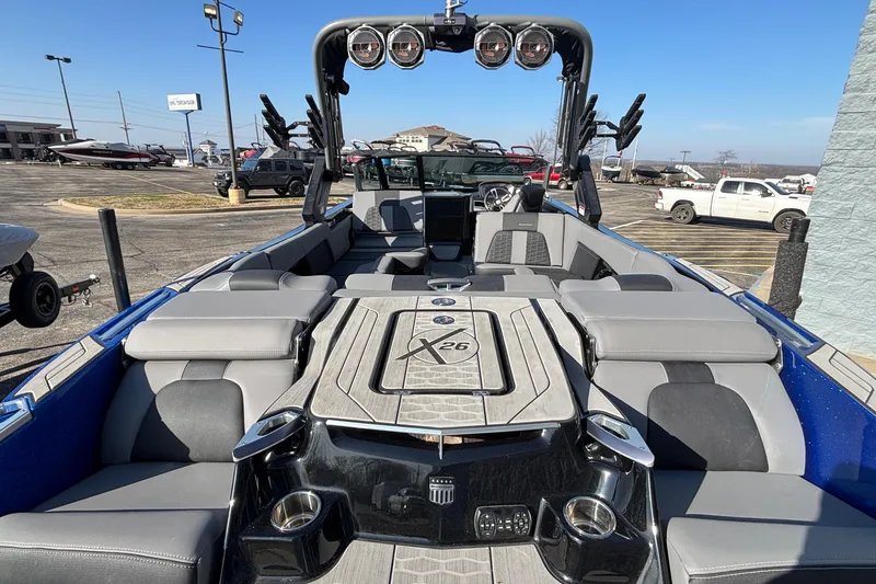 Slide: The Image of 2022 MasterCraft X26 boat interior with luxurious seating and modern design. - 9