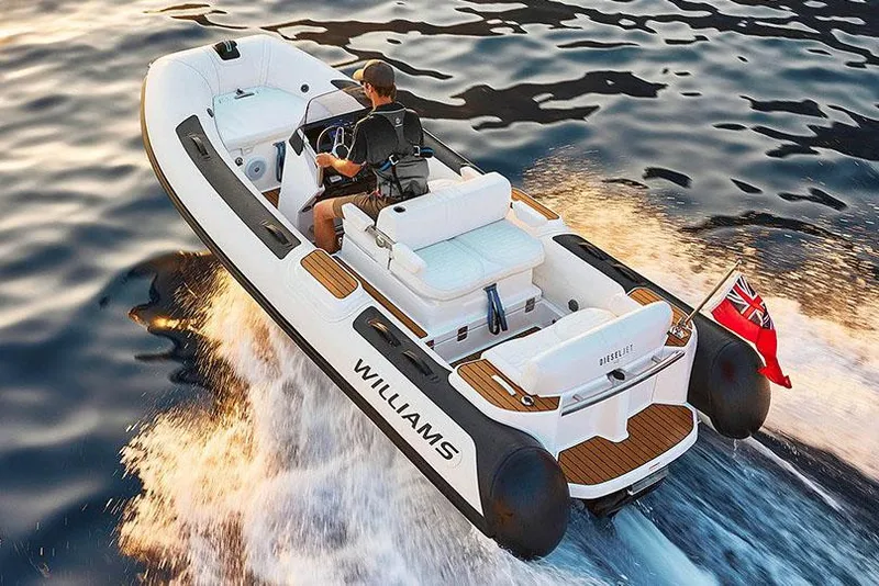 Slide: The Image of 2025 Williams Jet Tenders Dieseljet 445 on trailer in marina parking lot. - 2