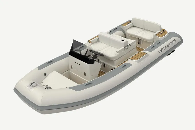 Slide: The Image of 2025 Williams Jet Tenders Dieseljet 445 on trailer, parked in marina with other boats. - 3