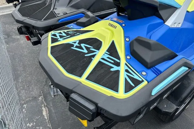 Slide: The Image of 2026 Yamaha WaveRunner JETBLASTER PRO in blue and yellow, rear view. - 29