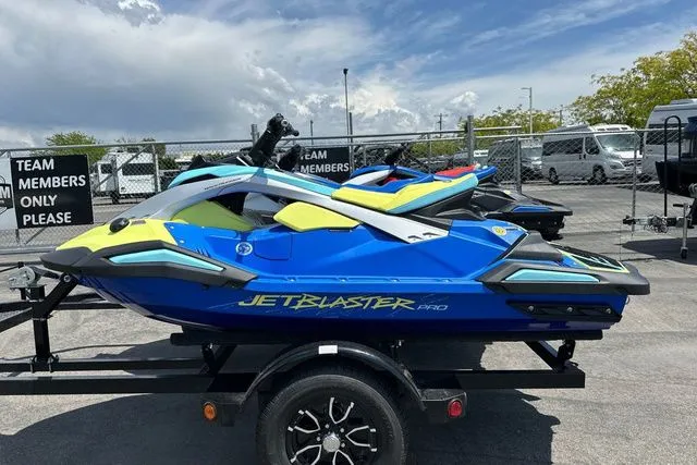 The Image of Yamaha WaveRunner Jetblaster Pro 2026 in blue and yellow on trailer. - 1