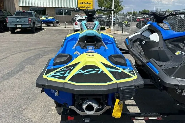 Slide: The Image of 2026 Yamaha WaveRunner JETBLASTER PRO in blue and yellow on a parking lot. - 21