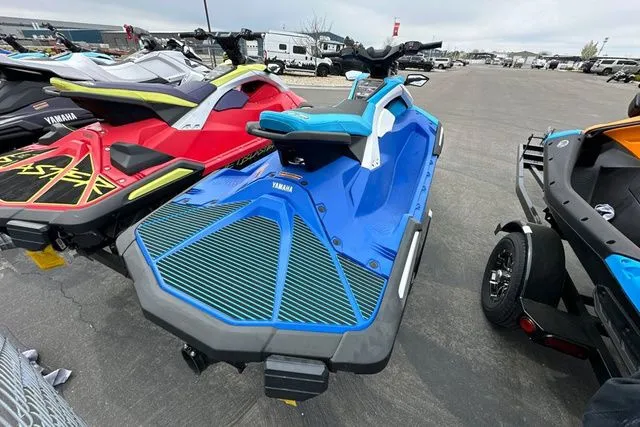 Slide: The Image of 2026 Yamaha WaveRunner JETBLASTER DLX in blue and white on a parking lot. - 21