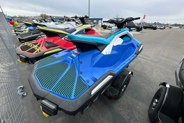Slide: The Image of 2026 Yamaha WaveRunner JETBLASTER DLX in blue and white on parking lot. - 22
