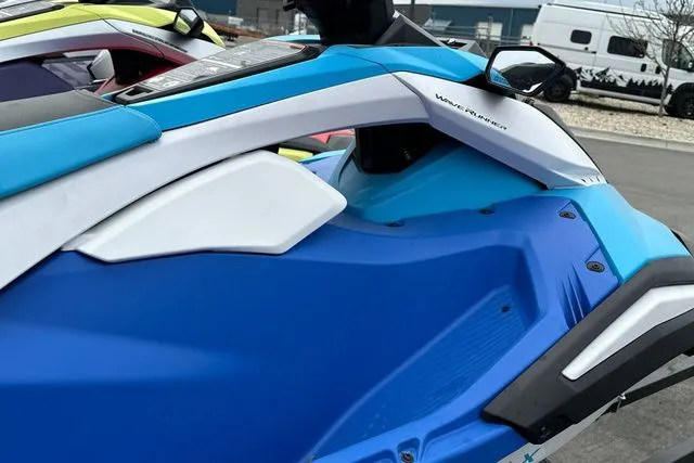 Slide: The Image of 2026 Yamaha WaveRunner Jetblaster in blue and white on parking lot. - 9