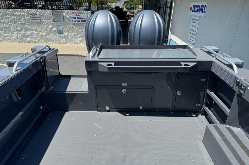 Slide: The Image of 2026 Duckworth 28 Offshore boat interior with storage compartments and twin engines. - 17
