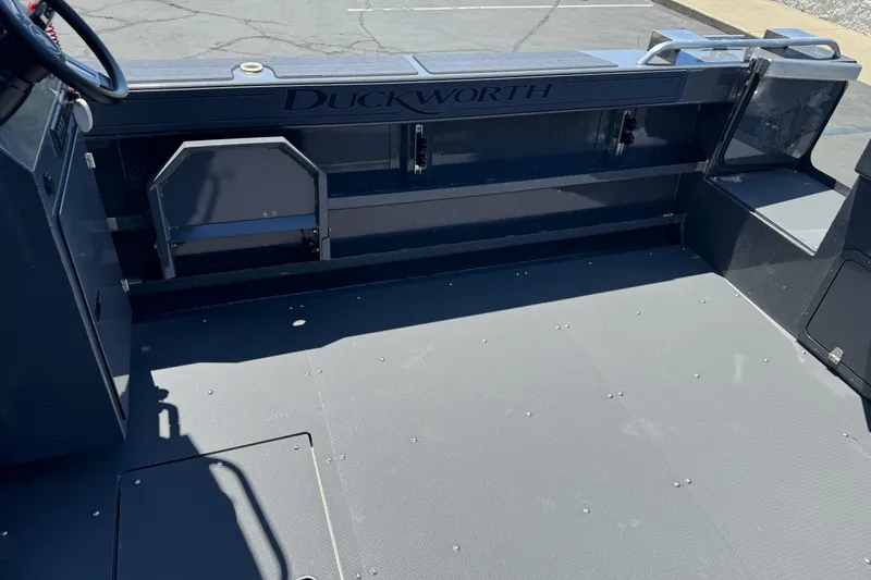 Slide: The Image of 2026 Duckworth 28 Offshore boat interior, showcasing spacious deck and seating area. - 18