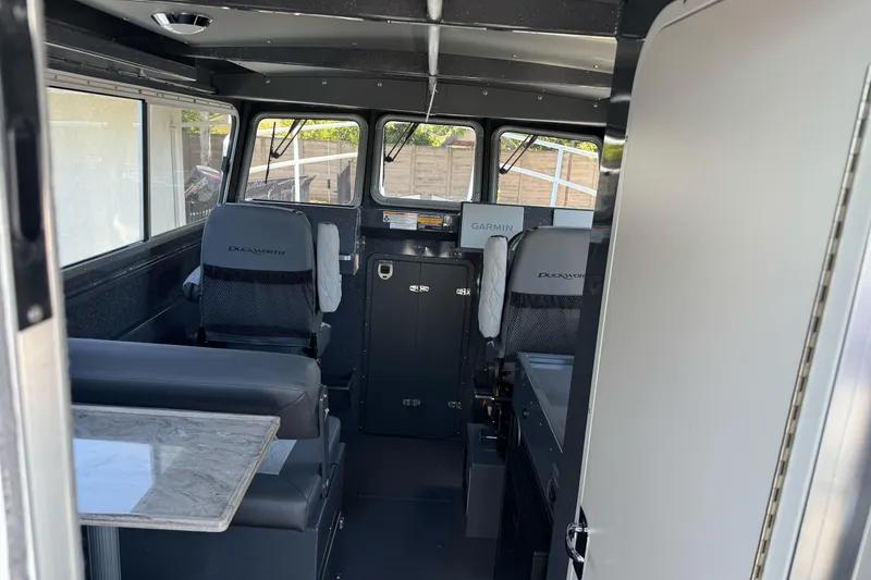 Slide: The Image of Interior of 2026 Duckworth 28 Offshore boat with seating and navigation equipment. - 25