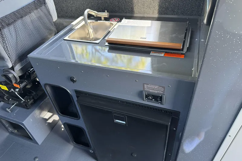 Slide: The Image of Compact kitchenette in 2026 Duckworth 28 Offshore boat with sink and storage. - 27