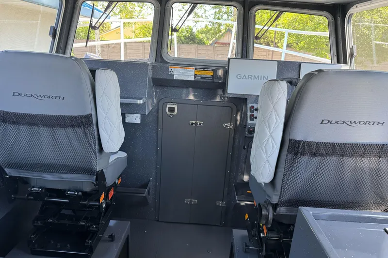 Slide: The Image of Interior of a 2026 Duckworth 28 Offshore boat with Garmin navigation system. - 28