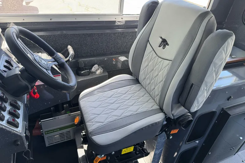 Slide: The Image of Interior of 2026 Duckworth 28 Offshore boat with steering wheel and cushioned captain's chair. - 31