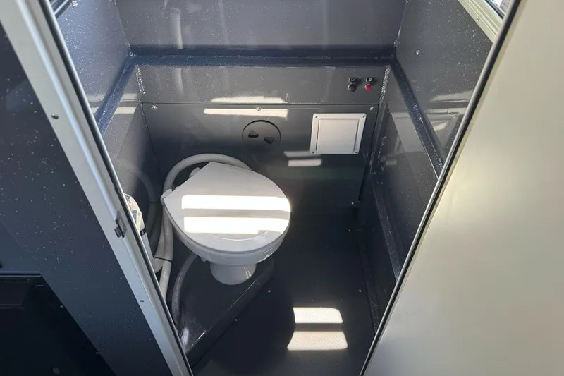 Slide: The Image of Interior of 2026 Duckworth 28 Offshore boat bathroom with toilet and compact design. - 36