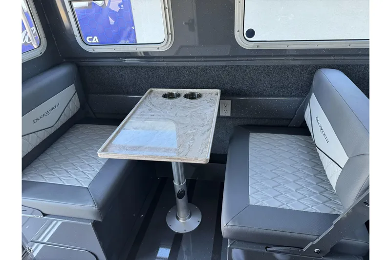 Slide: The Image of Interior of 2026 Duckworth 28 Offshore boat with seating and table. - 38