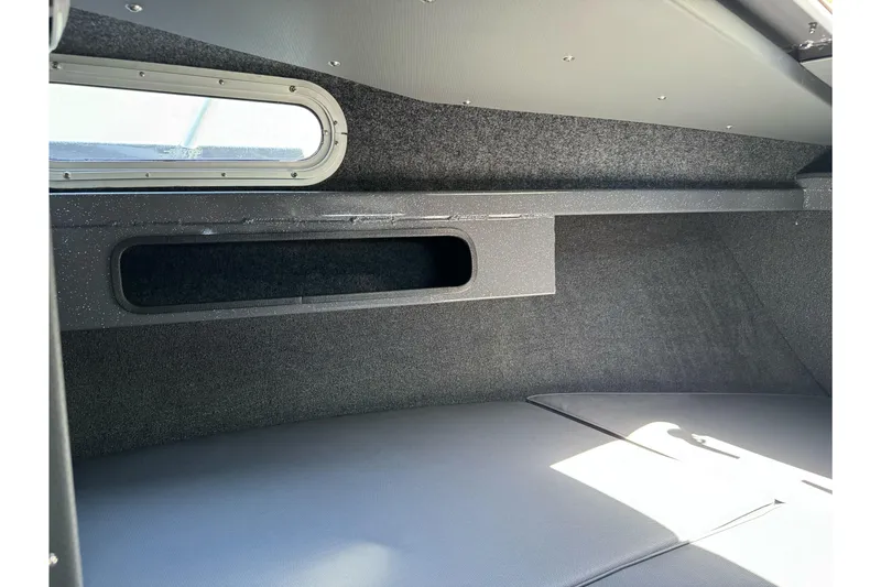 Slide: The Image of Interior cabin of 2026 Duckworth 28 Offshore boat, featuring sleek design and window. - 44