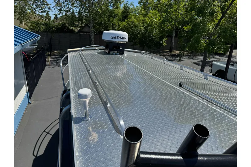 Slide: The Image of Rooftop view of 2026 Duckworth 28 Offshore boat with Garmin equipment, surrounded by trees. - 53