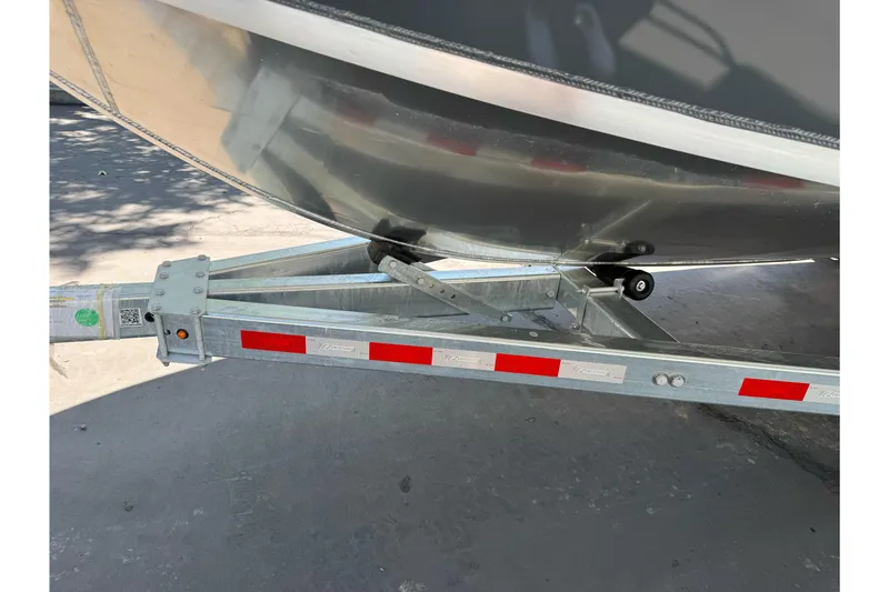 Slide: The Image of 2026 Duckworth 28 Offshore boat on trailer, showcasing hull and trailer details. - 57