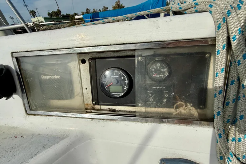 Slide: The Image of Control panel of a 1985 MacGregor 65 sailboat with Raymarine and Volvo Penta instruments. - 10