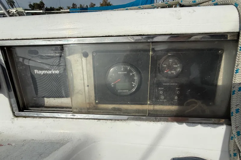 Slide: The Image of Control panel of a 1985 MacGregor 65 sailboat with Raymarine and Volvo Penta instruments. - 9