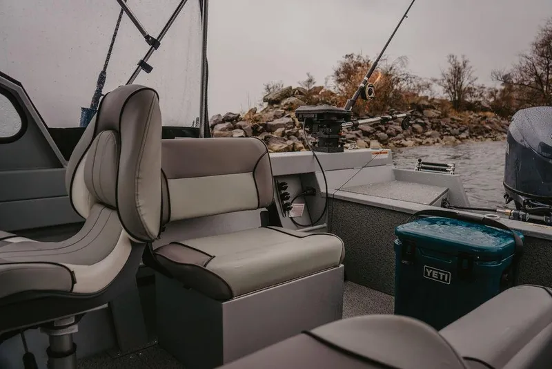 Slide: The Image of Interior of 2026 KingFisher 1625 Falcon boat with seating and fishing gear. - 4
