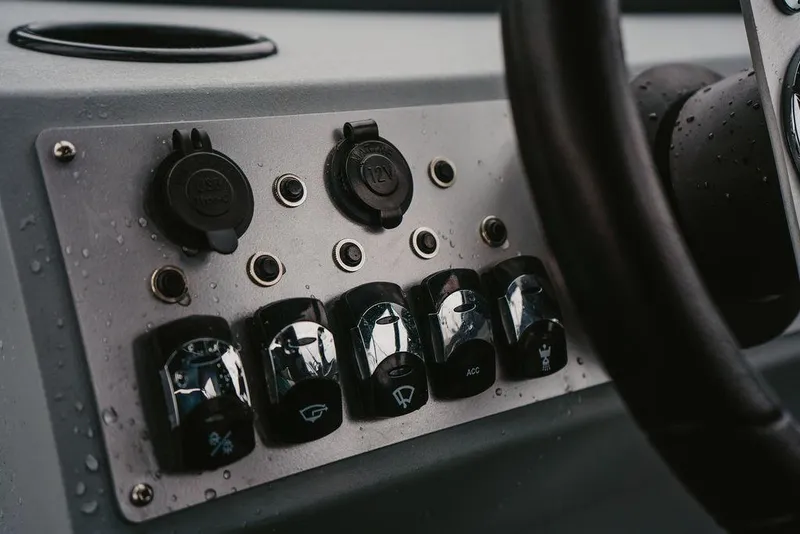 Slide: The Image of Control panel of 2026 KingFisher 1625 Falcon boat with switches and USB port. - 9