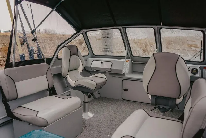 Slide: The Image of Interior of 2026 KingFisher 1625 Falcon boat with modern seating and dashboard. - 3