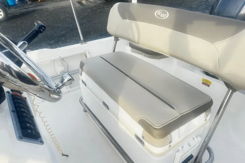 Slide: The Image of 2022 Key West 1720 Center Console boat interior with steering wheel and cushioned seating. - 6