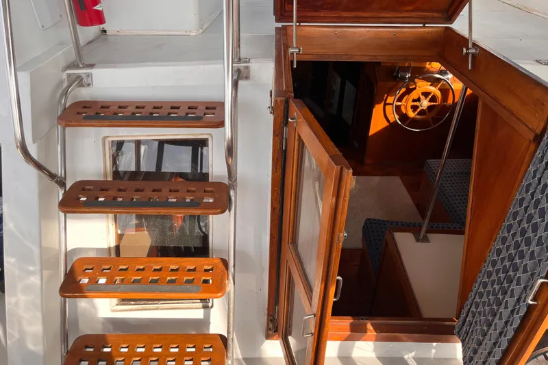 Slide: The Image of Staircase and cabin entrance of 1986 Jefferson 42 SE Sundeck Motor Yacht. - 17