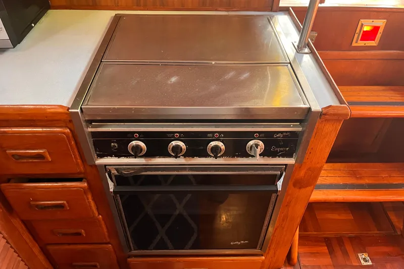 Slide: The Image of Vintage stove in 1986 Jefferson 42 SE Sundeck Motor Yacht kitchen. - 35