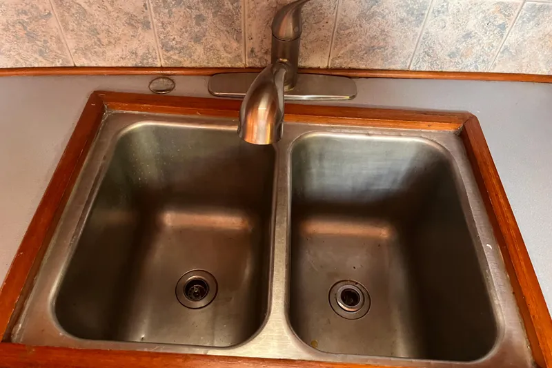 Slide: The Image of Stainless steel double sink on 1986 Jefferson 42 SE Sundeck Motor Yacht. - 37