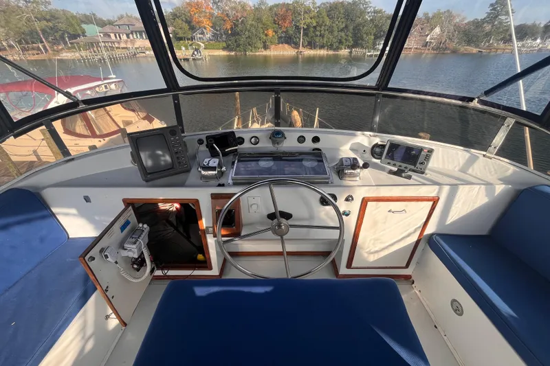 Slide: The Image of Cockpit of 1986 Jefferson 42 SE Sundeck Motor Yacht with steering wheel and navigation equipment. - 4