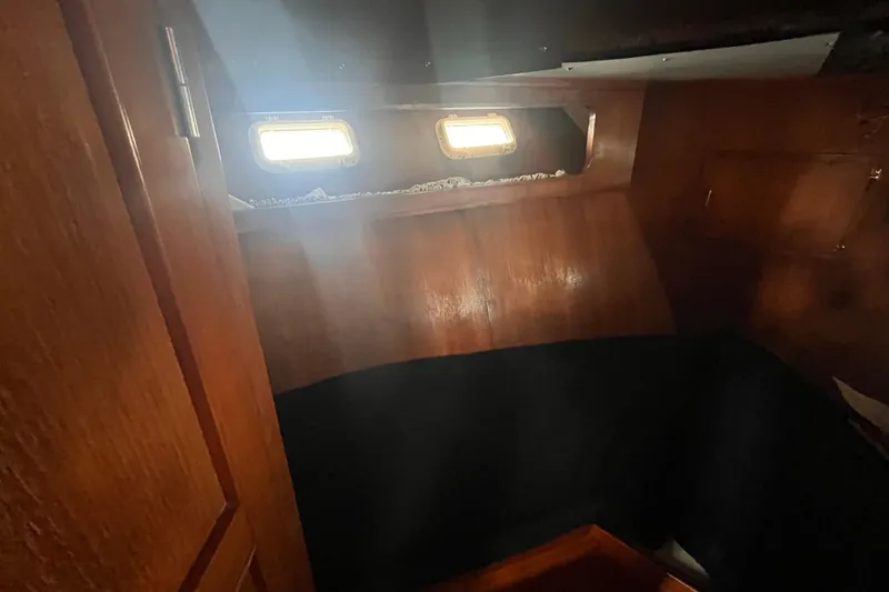 Slide: The Image of Interior cabin of 1986 Jefferson 42 SE Sundeck Motor Yacht with wooden paneling. - 41